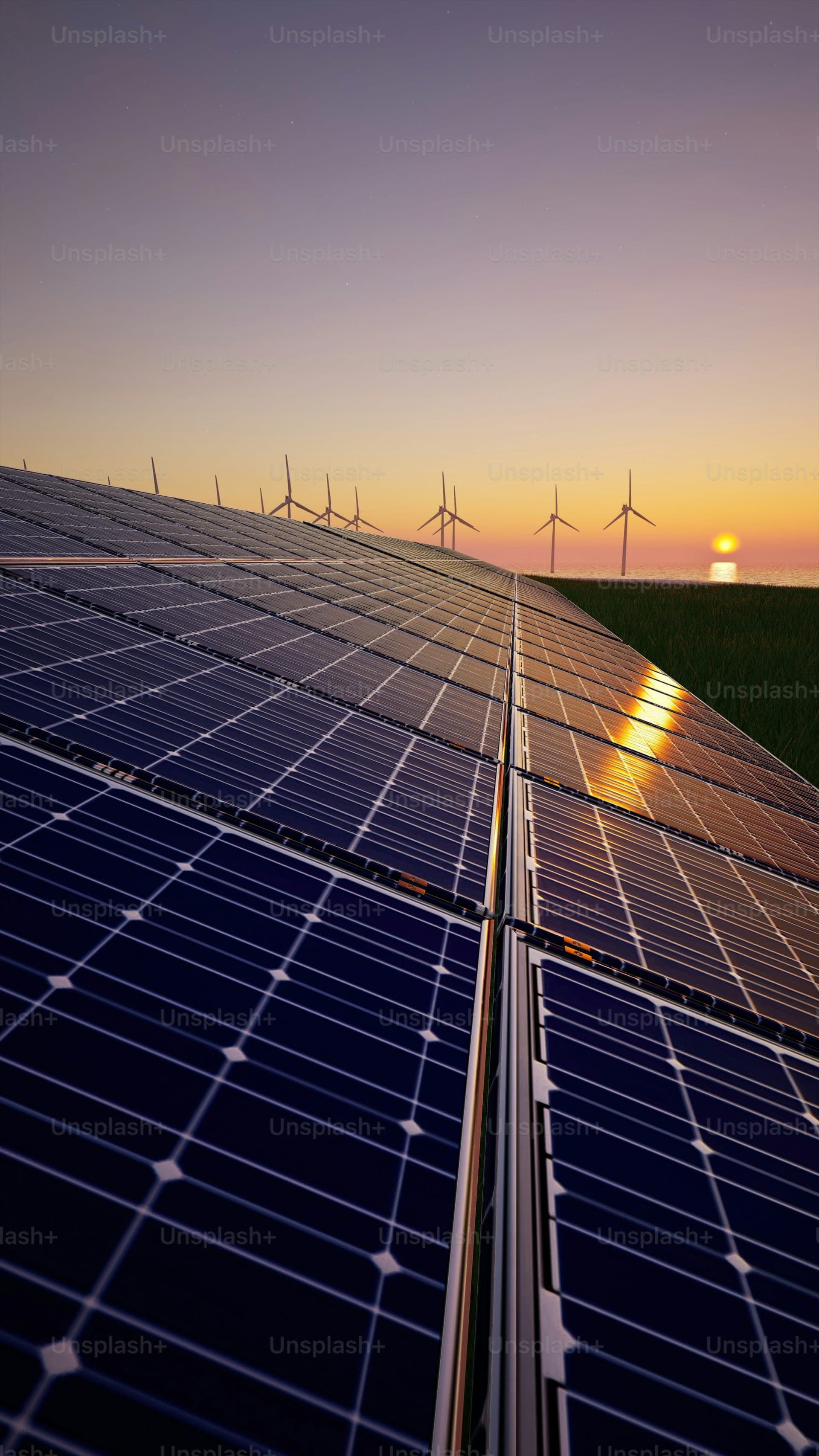 Solar panel with wind turbines at golden hour
