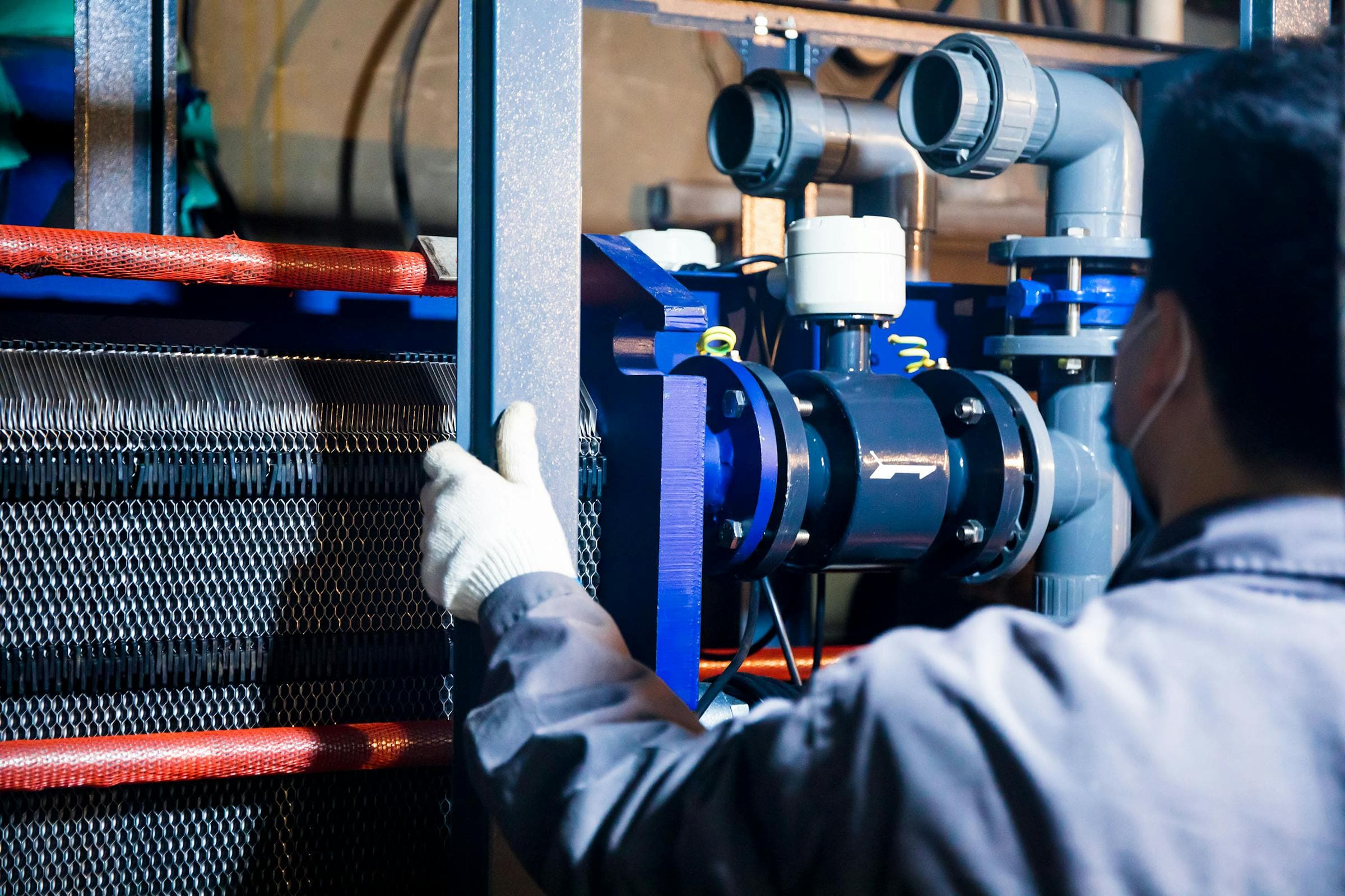 Engineer inspecting behind-the-meter power equipment